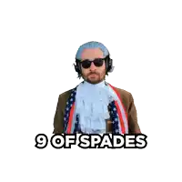 a man holding a playing card with the words 9 of spades below