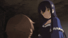 a girl with a skull on her ear is talking to another girl
