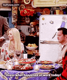 a group of people are sitting at a table with plates of food .