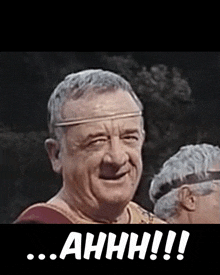 a man wearing a headband says ahhhh !!!