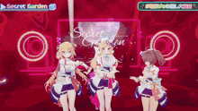 three anime girls are dancing in front of a screen that says secret garden on it