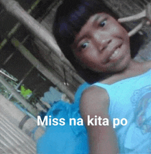 a girl in a blue dress with the words miss na kita po on the bottom right