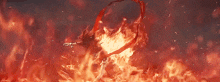 a person is standing in the middle of a fireball .
