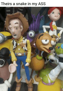 a group of toy story figures including woody and slinky dog