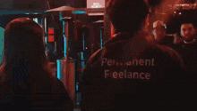 a group of people are sitting at a bar talking to each other