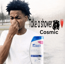 a man covering his nose next to a bottle of head & shoulders clean & balanced shampoo