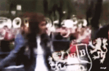 a blurry picture of a crowd with the letters rbd.gif on the bottom right