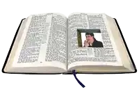 an open bible with a picture of a man praying in the middle of the page