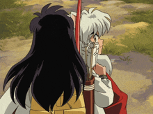 a boy and a girl are standing next to each other and the girl is holding an arrow