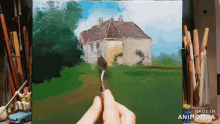 a person is painting a house with a spoon in front of a made in animatica logo