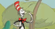 dr. seuss ' cat in the hat is standing next to a tree in a cartoon .