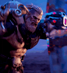 a man with a beard is wearing a helmet with the letter u on it