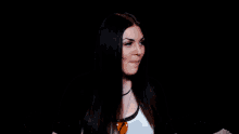 a woman with long black hair is wearing a white shirt with an orange fox on it
