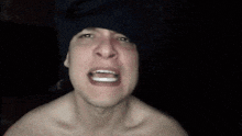 a shirtless man is making a funny face with the words aint nobody got time for that behind him