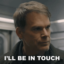 a man says " i 'll be in touch " while looking at something