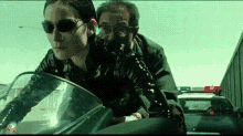 the matrix carrie anne moss trinity motorcycle dodging traffic