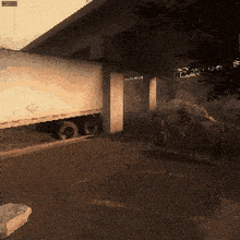 a pixelated image of a truck under a bridge with a sign that says ' i 'm sorry ' on it