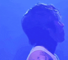 a close up of a person 's face with a purple background