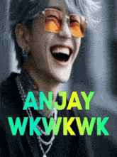 a man wearing sunglasses is laughing with the name anjay wkwkwk behind him