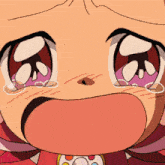 a close up of a child 's face with tears coming out of her eyes