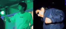 a man in a white shirt and a man in a blue jacket are dancing in front of a green light .