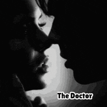 a black and white photo of two people kissing with the title shine on 100 % sexy the doctor
