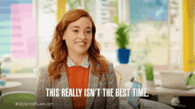 a woman is smiling and saying this really isn 't the best time .