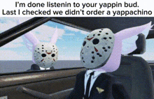 a man in a suit and tie is driving a car with a jason voorhees mask on .