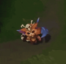 a cartoon character with horns is flying through the air in a video game .