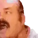a close up of a man 's face with a mustache and beard .