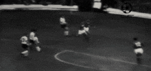 a blurry picture of a soccer game with the number 12 on the back