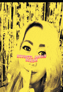 a woman holds her finger to her mouth with the words huussttt jangan berisik written in pink
