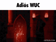 a man standing in a dark room with the words adios wuc on the bottom