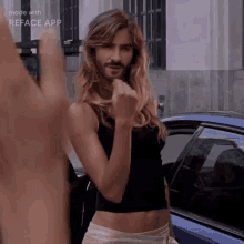 a woman with long hair and a beard giving the middle finger