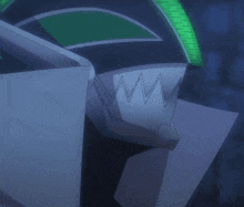 a green glowing object in the dark with a white object in the foreground