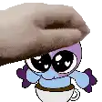 a cartoon character is sitting in a cup of coffee and being held by a hand .