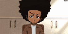 a cartoon character with a big afro is sitting in front of a cabinet