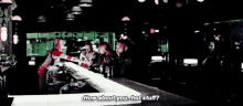 a group of people are sitting at a bar and one of them is asking how about you , hot stuff .