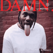 a man sticking his tongue out in front of a damn logo