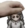 a pixel art of a hand putting a doll on top of a person 's head .