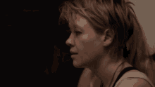 two women are looking at each other in a blurry photo