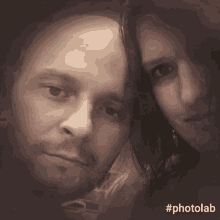 a man and a woman are posing for a photo with the hashtag photolab .