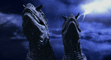 two dinosaurs are standing in the rain with a lightning strike in the background