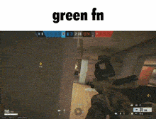 a person is holding a gun in a video game and the word green is on the bottom .