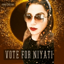 a woman wearing sunglasses and a headband with the words vote for niyati below her