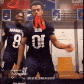 a man with the number 8 on his shirt is dancing