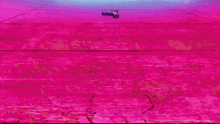 a purple letter x is on a pink background