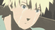 a close up of a person 's face with tears coming out of it .