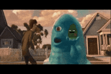 a blue monster with a green face is standing in front of a man
