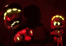 a cartoon character with glowing eyes is holding a glowing object in a dark room
